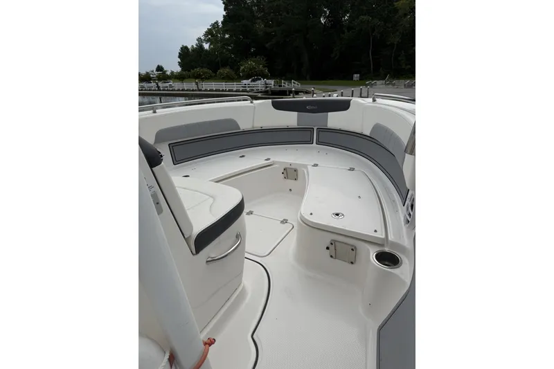 Slide: The Image of 2022 Robalo R222 Center Console boat interior with seating and storage compartments. - 5