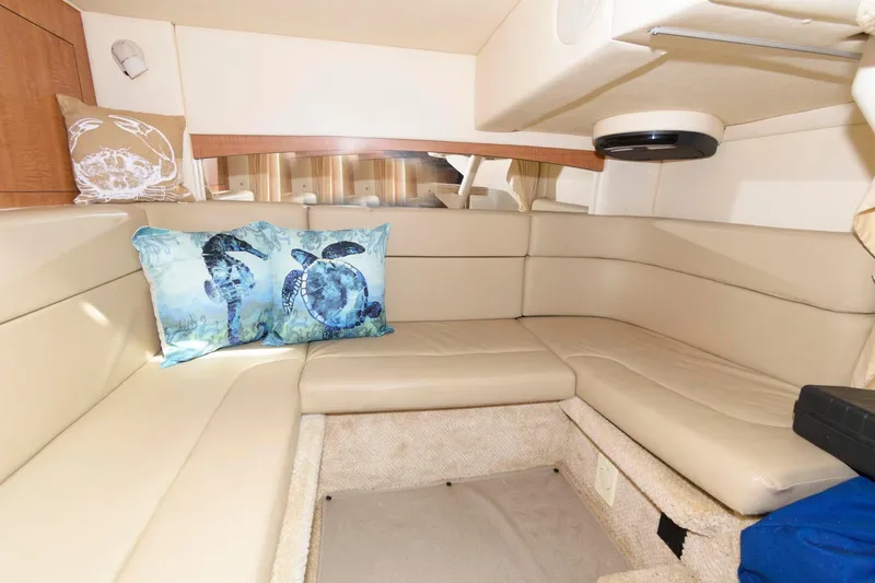 Slide: The Image of Interior of a 2006 Sea Ray Sundancer 320 with beige upholstery and decorative pillow. - 20