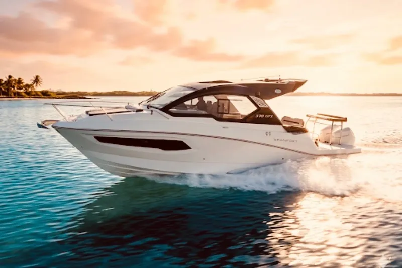 Slide: The Image of 2026 Granfort 370 GTX yacht cruising on serene tropical waters at sunset. - 7