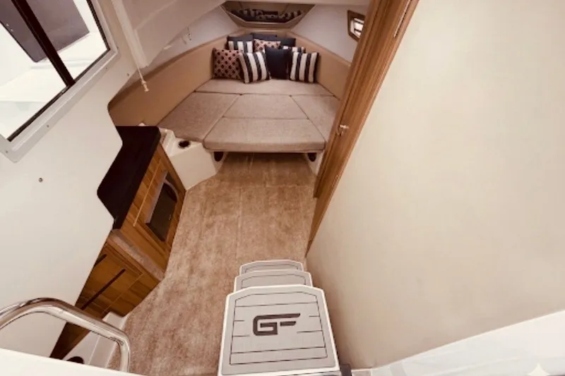 Slide: The Image of Interior of 2026 Granfort 370 GTX boat with cozy seating and modern amenities. - 4