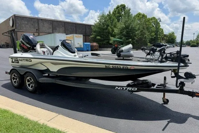 Slide: The Image of 2017 Nitro Z19 Pro fishing boat on trailer, parked outdoors under a cloudy sky. - 6