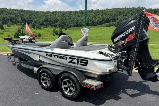 Slide: The Image of 2017 Nitro Z19 Pro fishing boat with Mercury Pro XS engine on a trailer. - 2