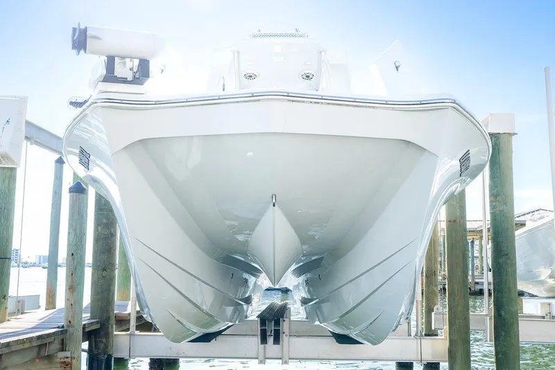 Slide: The Image of 2020 Costa Custom Boats 264HC on dock, showcasing sleek hull design. - 28