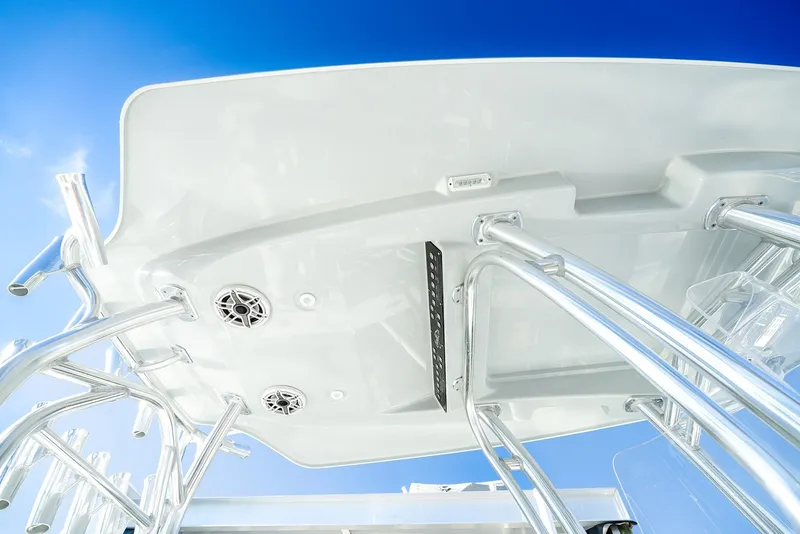 Slide: The Image of 2020 Costa Custom Boats 264HC, sleek design with polished metal supports against a clear blue sky. - 26