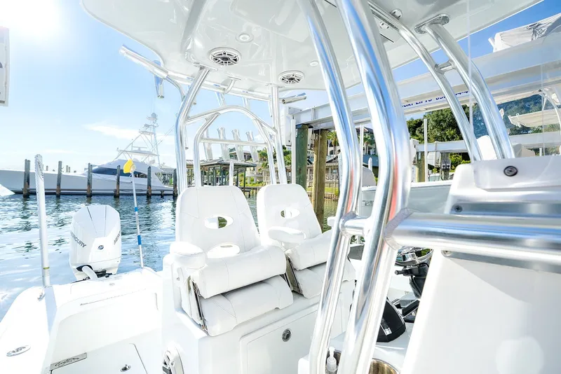 Slide: The Image of 2020 Costa Custom Boats 264HC interior with sleek design and modern features at a marina. - 18