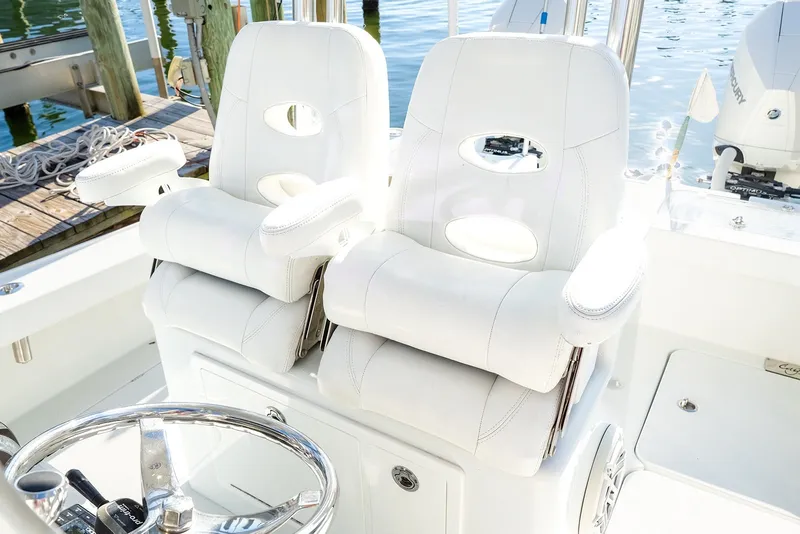 Slide: The Image of Luxury white seating on 2020 Costa Custom Boats 264HC, dockside view. - 19