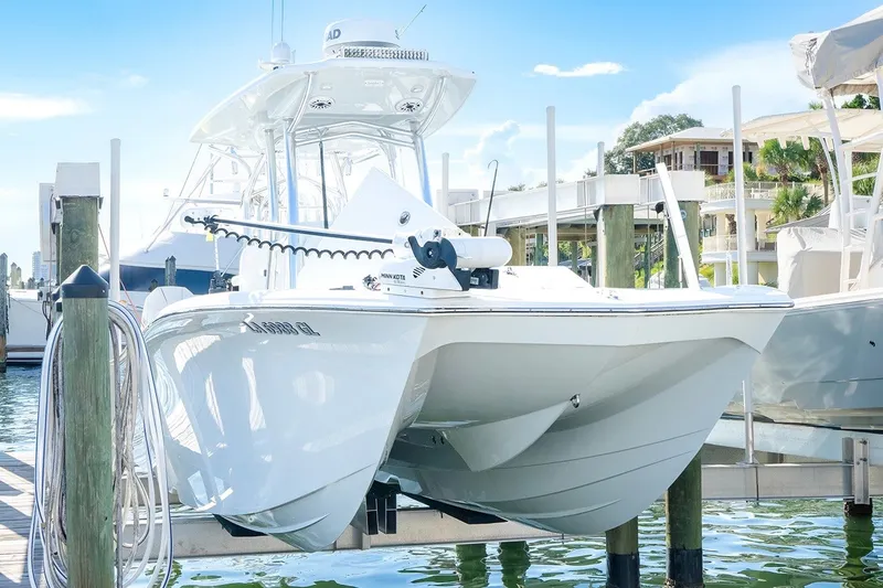 Slide: The Image of 2020 Costa Custom Boats 264HC docked at marina, showcasing sleek design and modern features. - 29