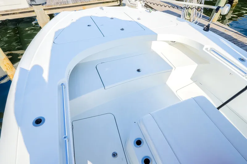 Slide: The Image of 2020 Costa Custom Boats 264HC deck with spacious seating and storage compartments. - 25