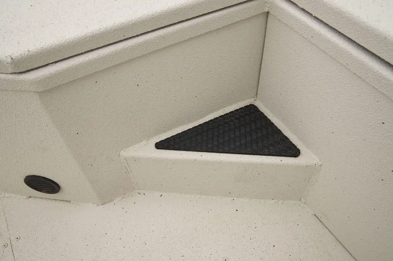Slide: The Image of Close-up of a triangular storage compartment on a 2024 Ranger RB210 boat. - 40