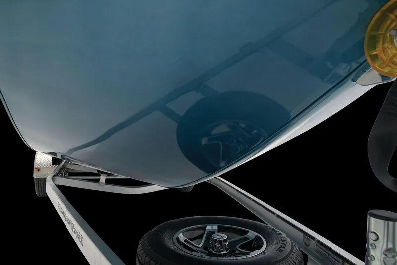 Slide: The Image of Close-up of a Ranger RB210 boat hull on a trailer, with a visible wheel. - 24