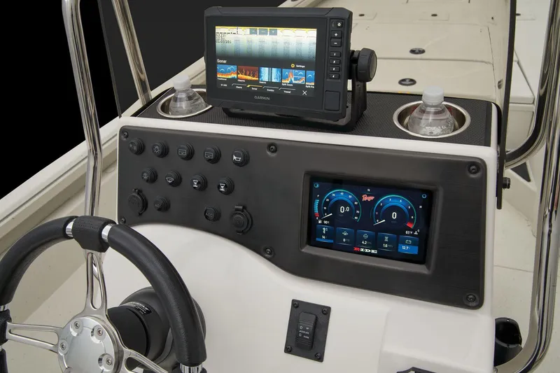 Slide: The Image of The dashboard of a 2024 Ranger RB210 boat with modern instruments and screens. - 49