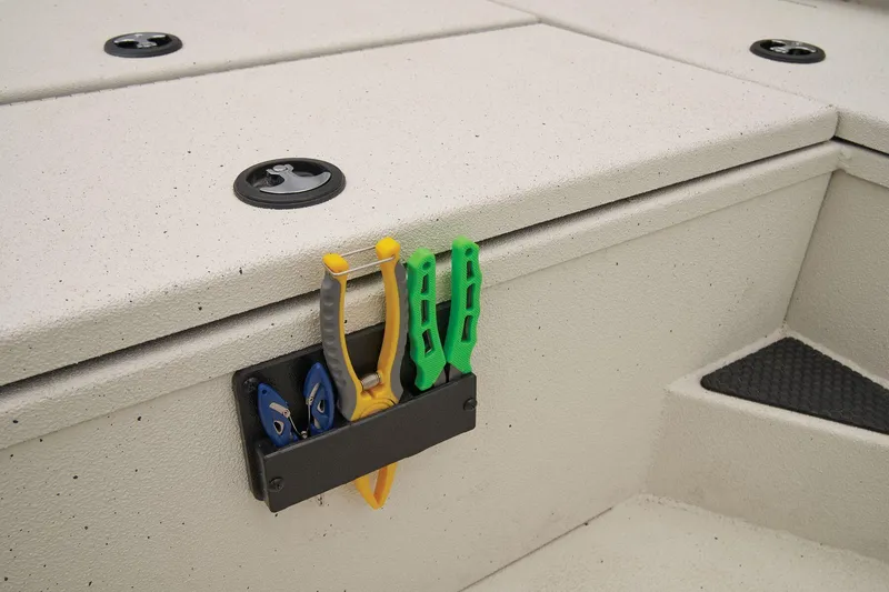 Slide: The Image of The image shows the deck of a Ranger RB210 boat with a tool holder. - 38