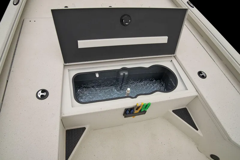 Slide: The Image of The image shows the open storage compartment of a 2024 Ranger RB210 boat with water inside. - 34
