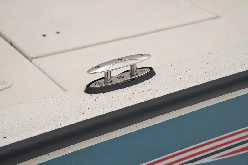 Slide: The Image of Close-up of a boat deck with a silver cleat on a blue surface. - 28
