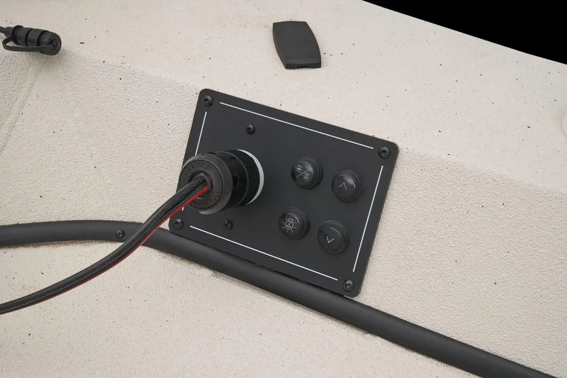 Slide: The Image of A control panel with multiple switches and a connector on a boat. - 31