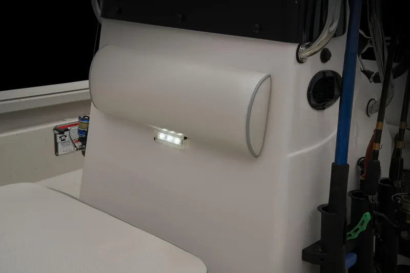 Slide: The Image of The image shows the interior of a 2024 Ranger RB210 boat with fishing rod holders. - 42