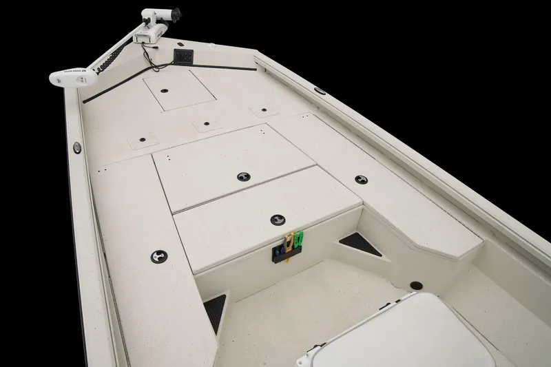 Slide: The Image of The image shows the deck of a 2024 Ranger RB210 boat with storage compartments and a trolling motor. - 29