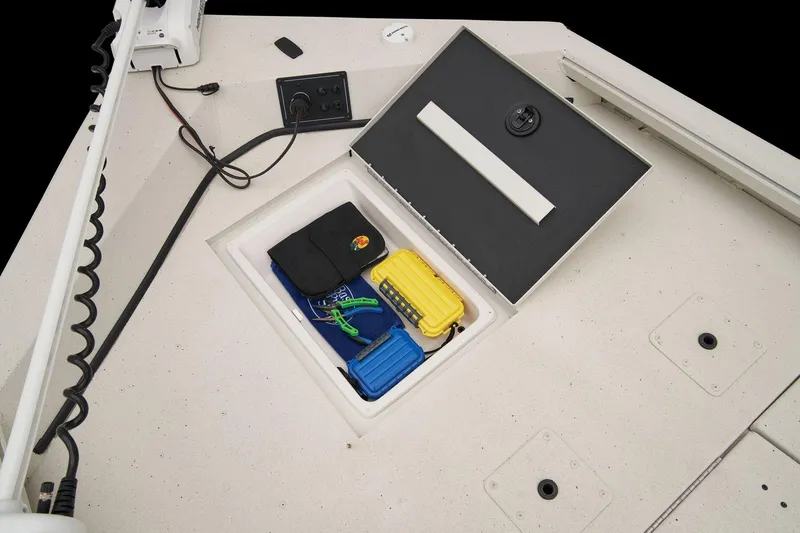 Slide: The Image of The image shows an open storage compartment on a boat with various items inside. - 32