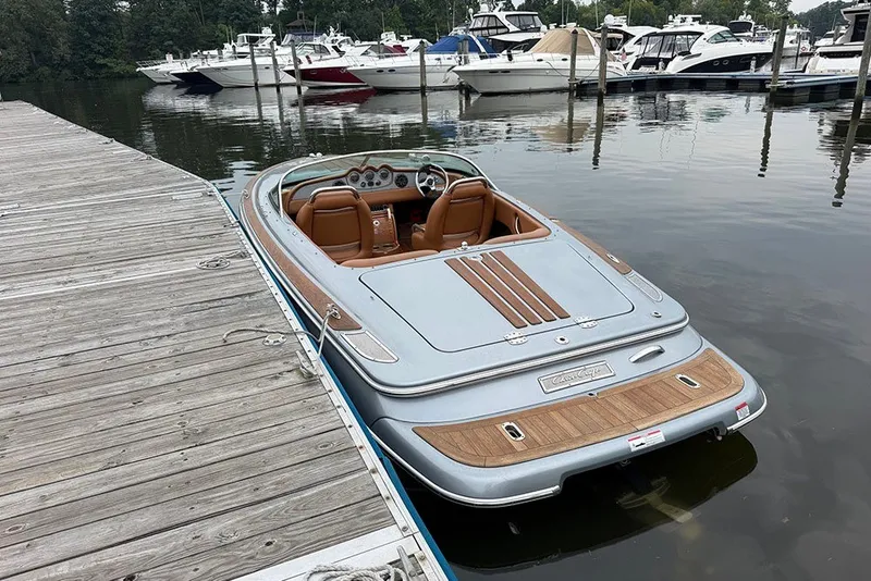 Slide: The Image of 2011 Chris-Craft Silver Bullet 20 boat docked at marina with luxury design. - 6