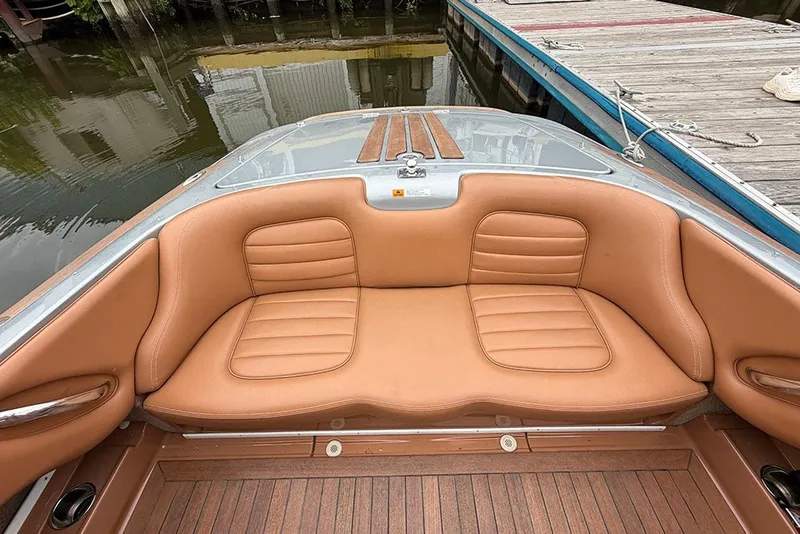 Slide: The Image of Luxurious interior of 2011 Chris-Craft Silver Bullet 20 boat with tan leather seating. - 11