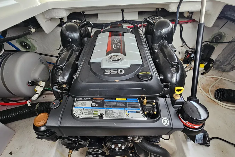 Slide: The Image of Engine compartment of a 2021 Monterey 295 Sport Yacht, featuring a 350 horsepower engine. - 20