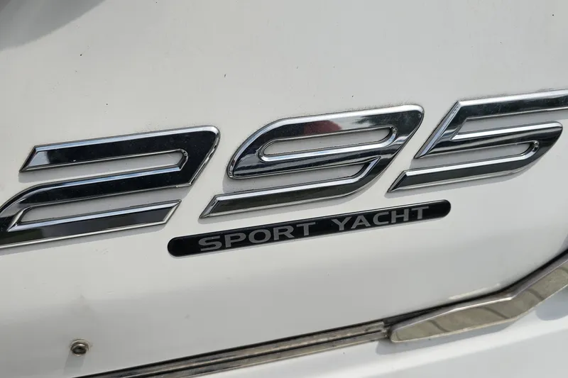 Slide: The Image of Close-up of 2021 Monterey 295 Sport Yacht emblem on white surface. - 23