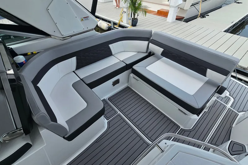Slide: The Image of Luxurious seating area on 2021 Monterey 295 Sport Yacht, docked at marina. - 6