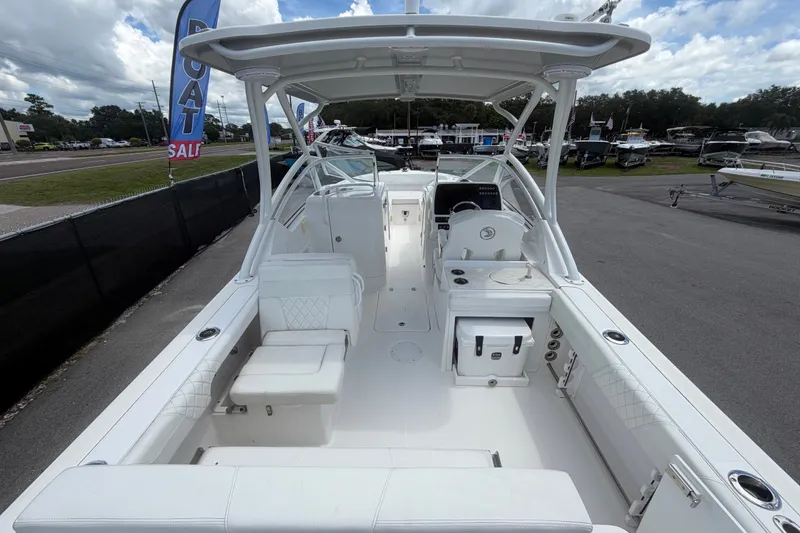 Slide: The Image of 2023 Edgewater 248CX Crossover boat interior, featuring spacious seating and modern design. - 13