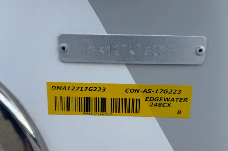 Slide: The Image of 2023 Edgewater 248CX Crossover identification plate with serial number and barcode. - 89