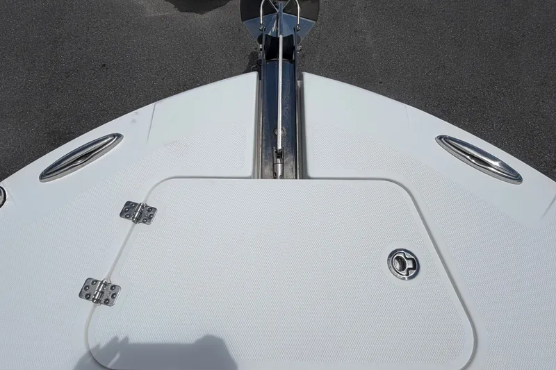 Slide: The Image of Bow of 2023 Edgewater 248CX Crossover boat with anchor hatch and stainless steel fittings. - 63
