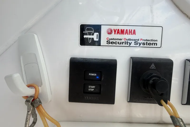Slide: The Image of Yamaha security system on 2023 Edgewater 248CX Crossover boat dashboard. - 51