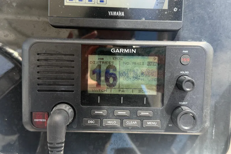 Slide: The Image of Garmin marine radio on 2023 Edgewater 248CX Crossover boat dashboard. - 44