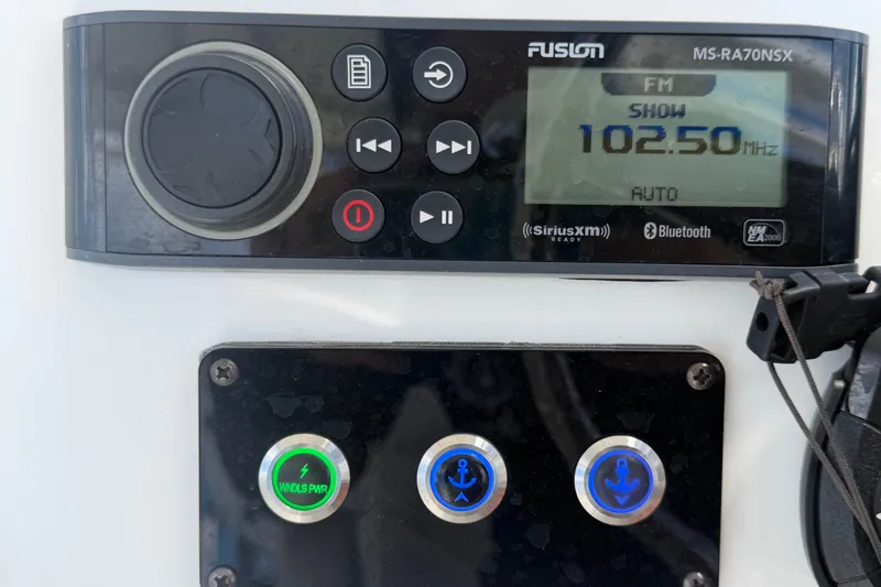 Slide: The Image of Fusion marine stereo and control panel on 2023 Edgewater 248CX Crossover boat. - 43