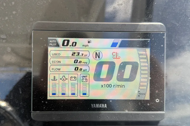 Slide: The Image of Digital display on 2023 Edgewater 248CX Crossover showing speed, fuel usage, and engine metrics. - 42