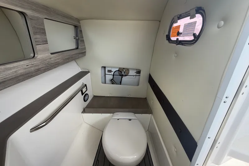 Slide: The Image of 2023 Edgewater 248CX Crossover boat interior with modern bathroom amenities. - 33