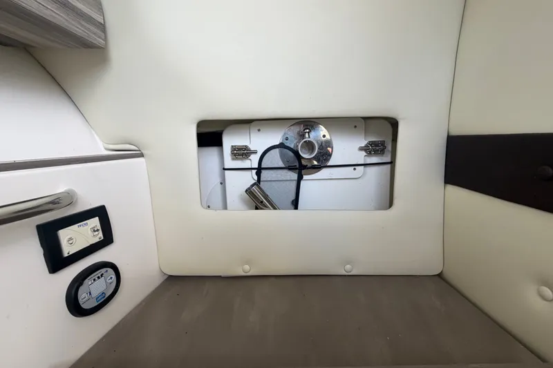Slide: The Image of Interior of an Edgewater 248CX Crossover with upholstery and technical connections. - 34