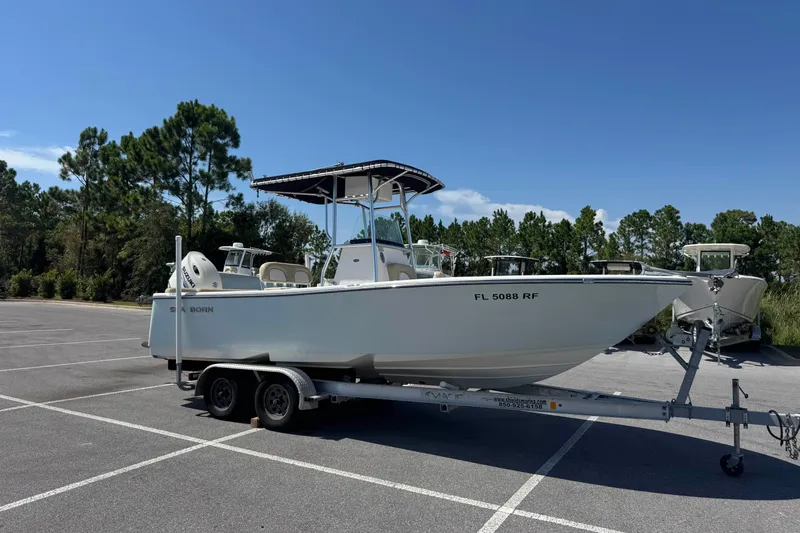 The Image of 2017 Sea Born LX22 Center Console boat on trailer in parking lot. - 0