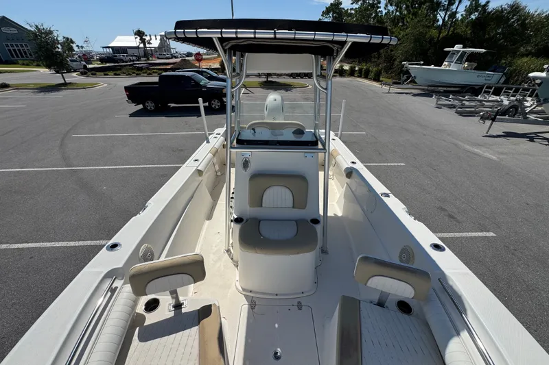 Slide: The Image of 2017 Sea Born LX22 Center Console boat in a parking lot, showcasing seating and console. - 10