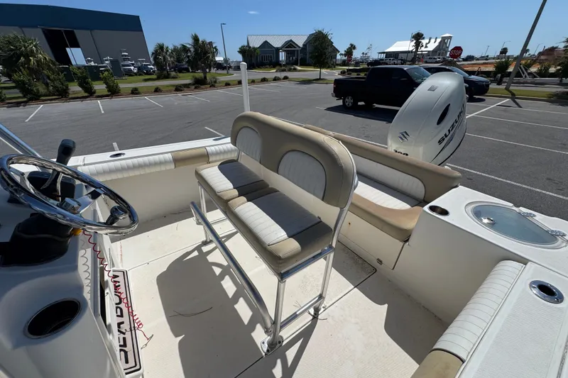 Slide: The Image of 2017 Sea Born LX22 Center Console boat interior with seating and steering wheel. - 9