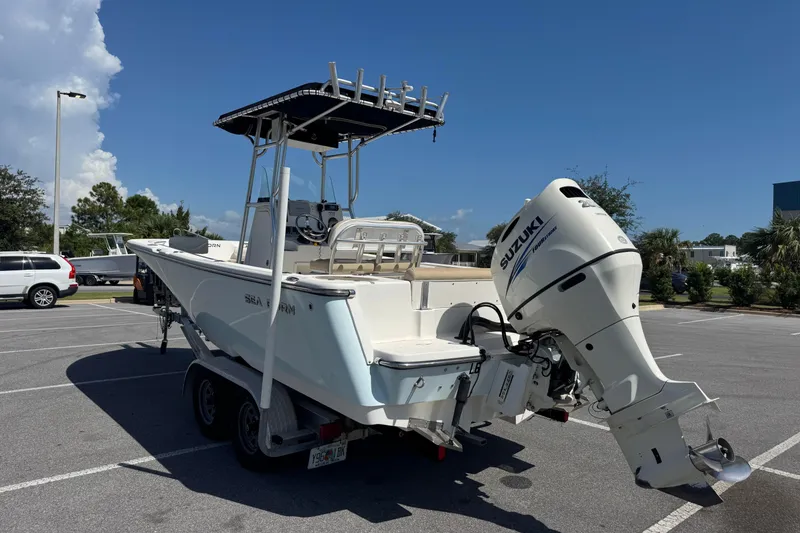 Slide: The Image of 2017 Sea Born LX22 Center Console boat with Suzuki outboard motor in parking lot. - 4
