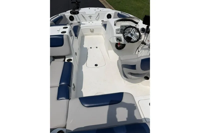 Slide: The Image of Interior of a 2017 Tahoe 1950 boat with blue and white seating. - 10