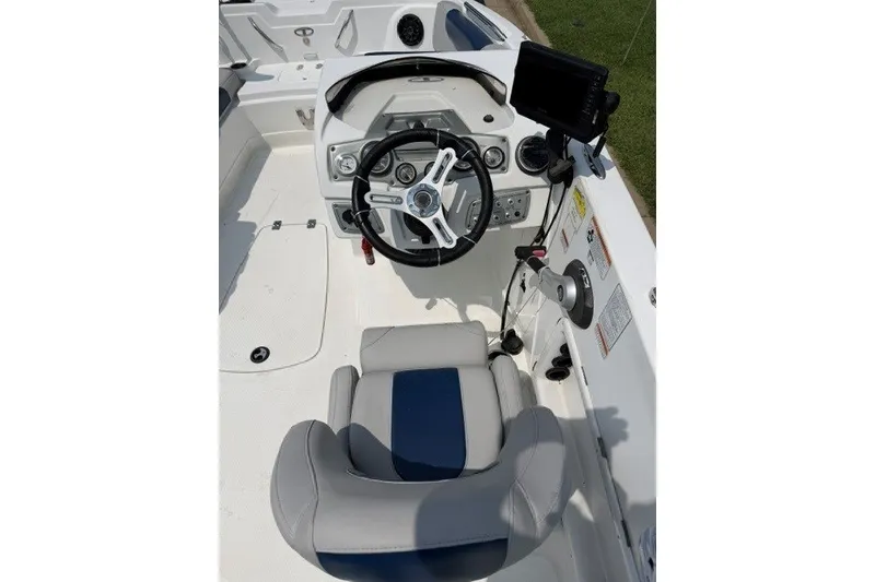 Slide: The Image of Cockpit of a 2017 Tahoe 1950 boat with steering wheel and control panel. - 1