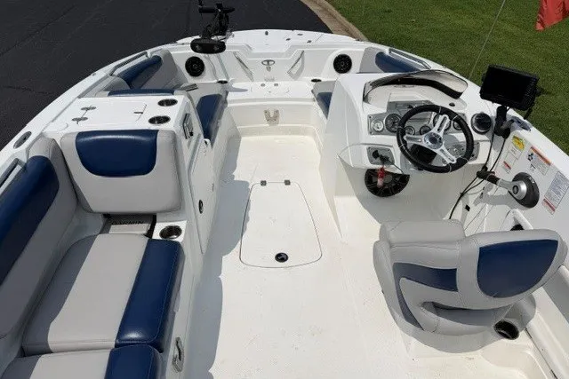 Slide: The Image of Interior view of a 2017 Tahoe 1950 boat with blue and white seating. - 11