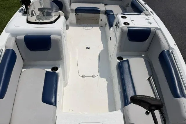 Slide: The Image of Interior of a 2017 Tahoe 1950 boat with blue and white seating. - 14