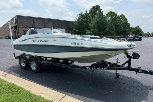 Slide: The Image of Tahoe 1950 boat on trailer, parked outdoors, 2017 model. - 4