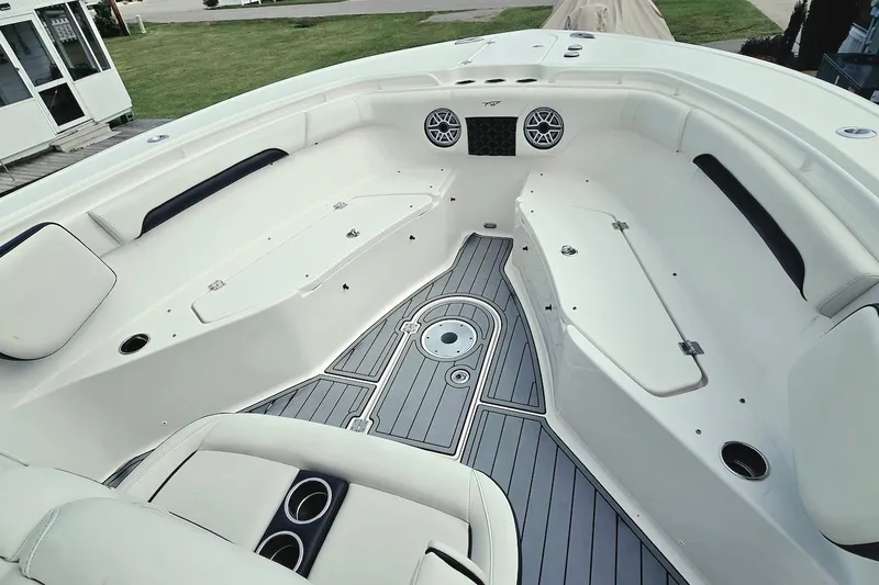 Slide: The Image of Interior view of 2022 Tidewater 282 CC Adventure boat, featuring spacious seating and modern design. - 18