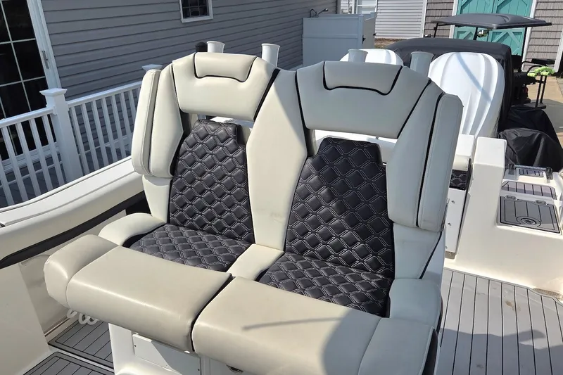 Slide: The Image of 2022 Tidewater 282 CC Adventure boat seats with quilted upholstery and modern design. - 17