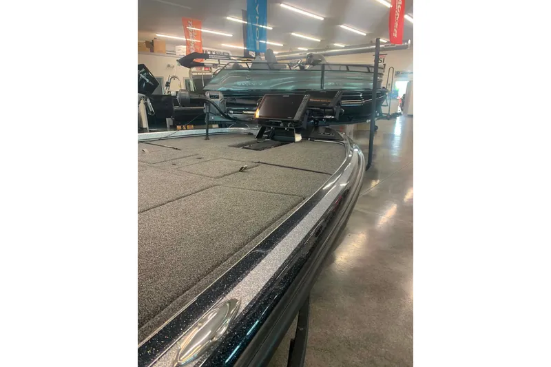 Slide: The Image of 2022 Nitro Z21 XL boat in showroom, featuring sleek design and advanced equipment. - 11