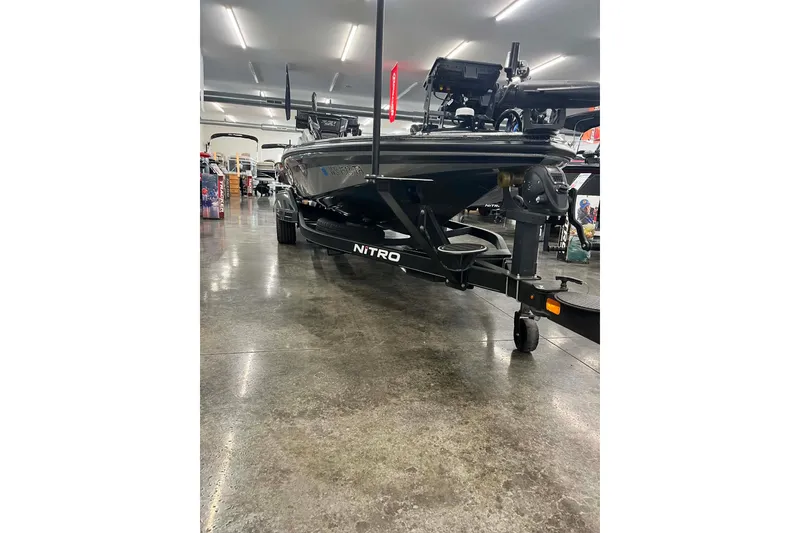 Slide: The Image of 2022 Nitro Z21 XL boat on display in a showroom, showcasing sleek design. - 6