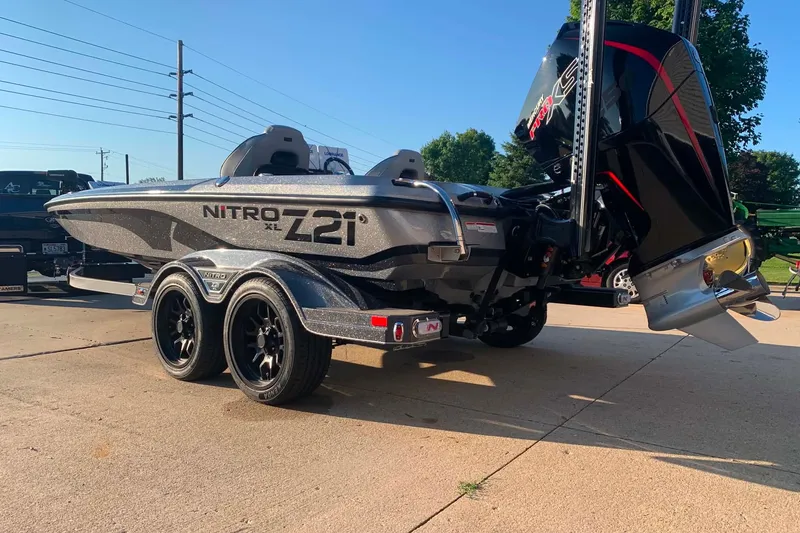 Slide: The Image of 2022 Nitro Z21 XL boat on trailer, featuring sleek design and powerful engine. - 3